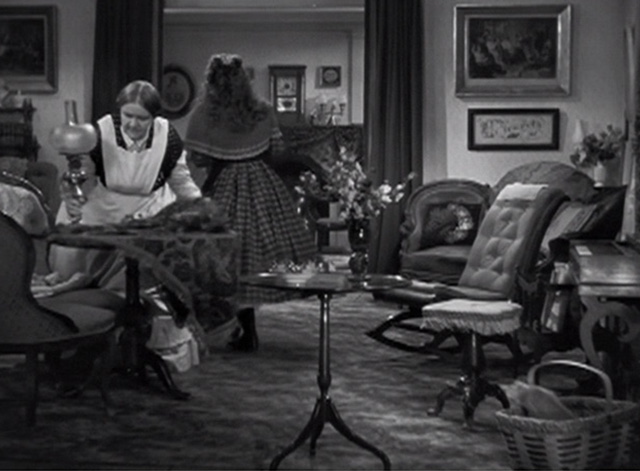 Little Women - tabby kitten climbing out of basket as Beth Jean Parker walks away