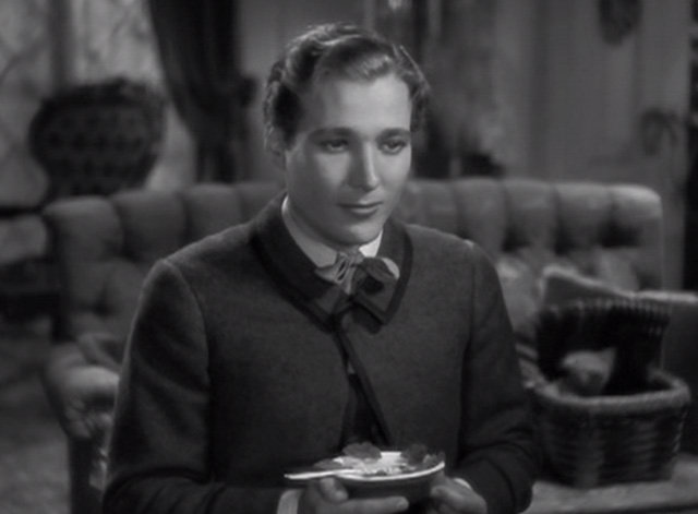 Little Women - Laurie Douglass Montgomery sitting with tabby kitten popping out of basket in background