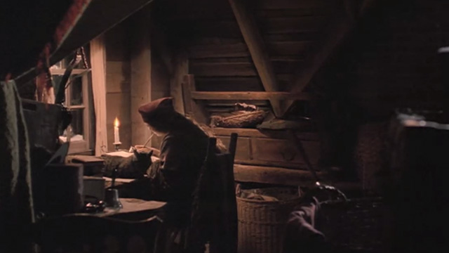 Little Women - tabby cat sitting next to Jo Winona Ryder as she writes