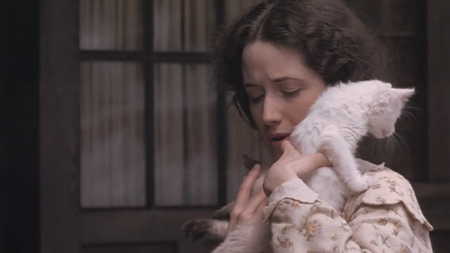 Little Women - Beth Claire Danes holding white and Siamese kittens