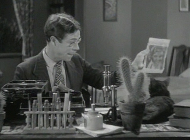 Local Boy Makes Good - John shows black cat picture