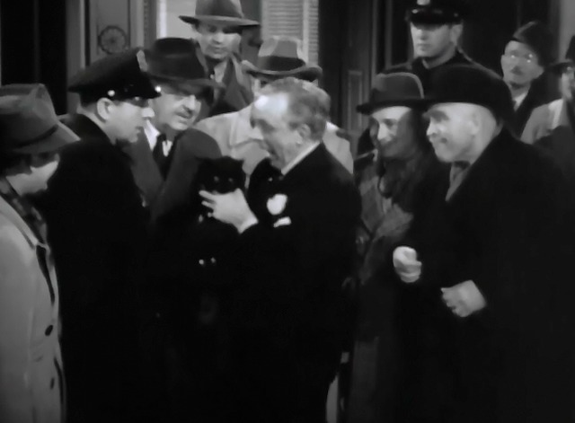 The Lone Wolf Takes a Chance - jewelry clerk claiming black cat with pearl necklace