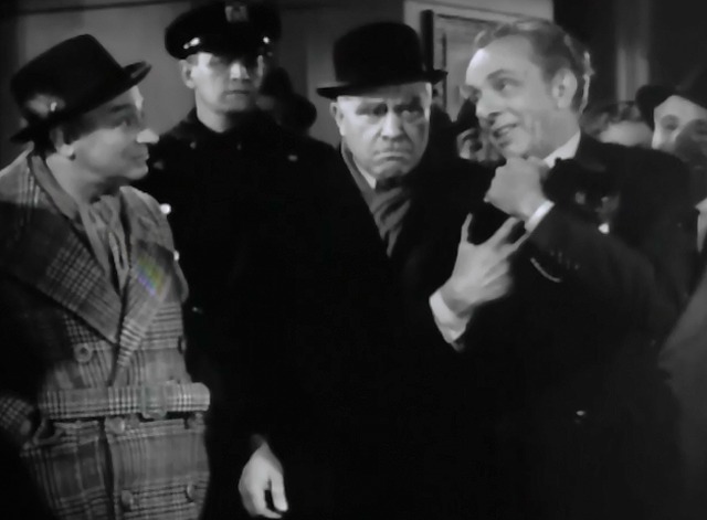 The Lone Wolf Takes a Chance - jewelry clerk holding black cat with pearl necklace