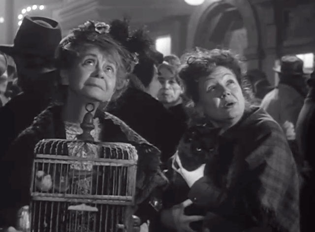The Long Night - Mrs. Tully Queenie Smith holding black cat Napoleon on street with woman holding bird cage Ida Moore