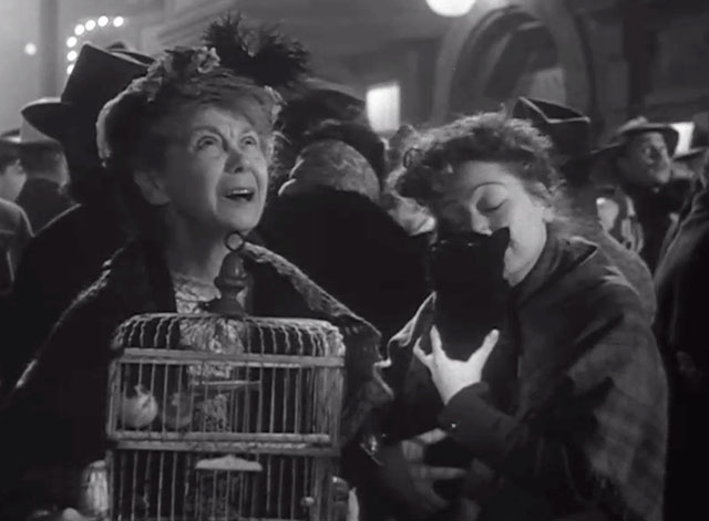 The Long Night - Mrs. Tully Queenie Smith holding black cat Napoleon on street with woman holding bird cage Ida Moore