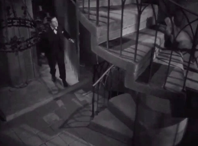 The Lost Moment - Venable Robert Cummings following tabby cat up spiral staircase