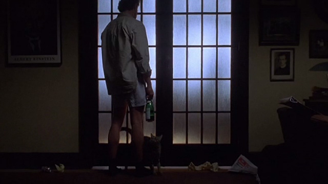 Love Potion No. 9 - tabby cat at the feet of Paul Tate Donovan