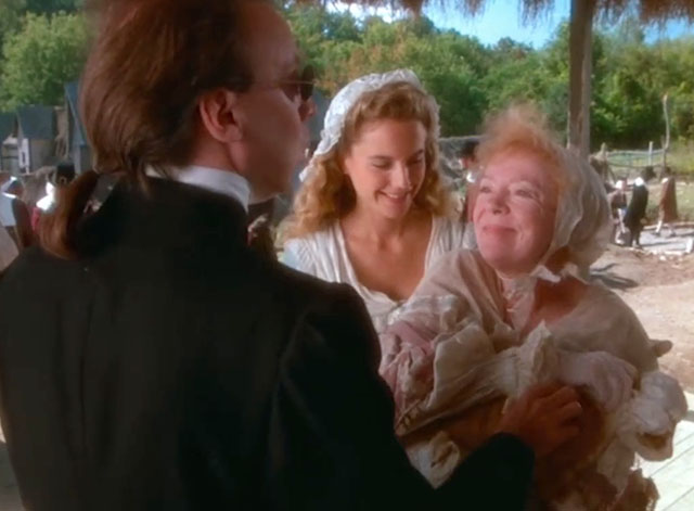 Love at Stake - Aunt Deliverence Norma MacMillan holding ginger and white tabby cat in bonnet and dress with Parson Bud Cort