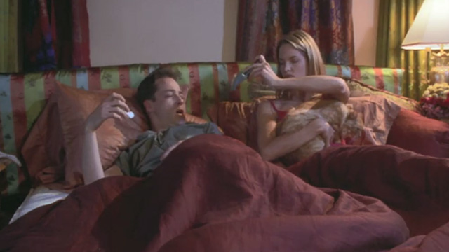 Love Stinks - Chelsea Bridgette Wilson brushing longhaired ginger tabby Gracie in bed with Seth French Stewart