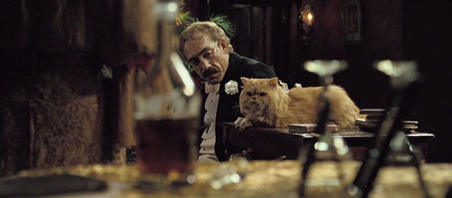 Love in the Time of Cholera - Florentino Ariza Javier Bardem with ginger Persian cat on table