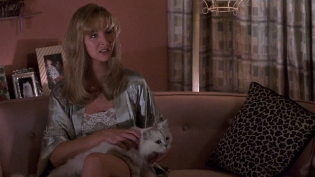 Lucky Numbers - white Angora cat sitting on sofa with Crystal Lisa Kudrow