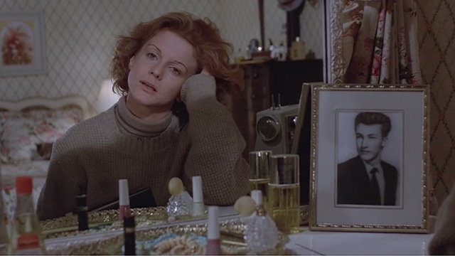 Magic - tabby cat on bed behind Peggy Ann Ann Margret