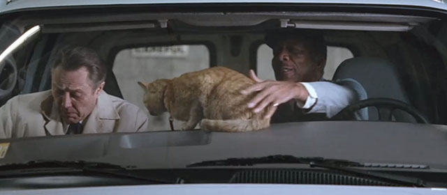 The Maiden Heist - Charles Morgan Freeman and Roger Christopher Walken climbing into van with ginger tabby cat Renoir on dashboard