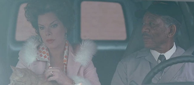 The Maiden Heist - Charles Morgan Freeman with Rose Marcia Gay Harden holding ginger tabby cat Renoir in van