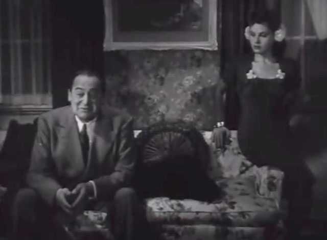 Main Street After Dark - Lieutenant Lorrigan Edward Arnold sitting on couch with black cat lying beside him with Rosalie Dorothy Morris
