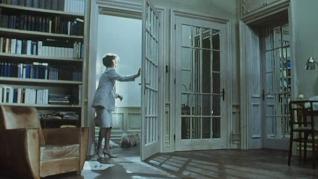 Malina - woman Isabelle Huppert tossing white and cream colored longhair cats out of room