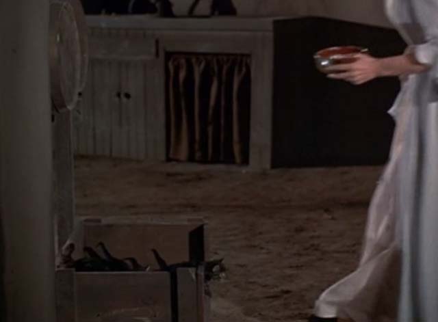 A Man Alone - kittens in box as woman approaches