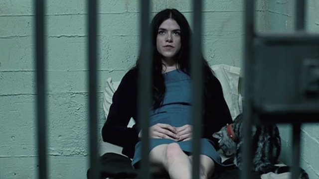 Manson, My Name is Evil - tabby cat sitting next to Katie Kaniehtiio Horn in prison cell