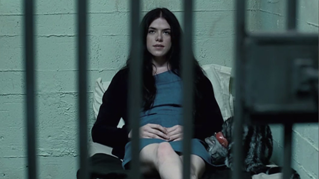 Manson, My Name is Evil - tabby cat sitting next to Katie Kaniehtiio Horn in prison cell