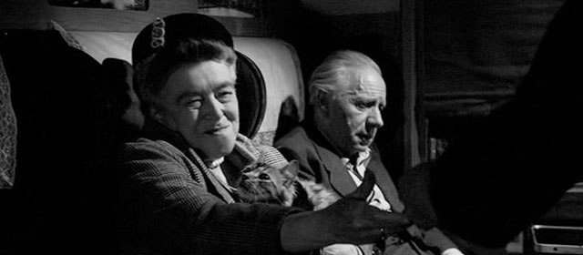 The Man Who Finally Died - woman Miriam Pritchett sitting in train compartment with tabby cat Putzi and Professor Schiller Harold Scott