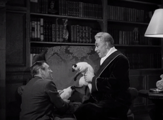 The Mask of Dimitrios - Cornelius Leydon Peter Lorre and Grudek Victor Francen with two Siamese cats Eloisa and Abelard on divan