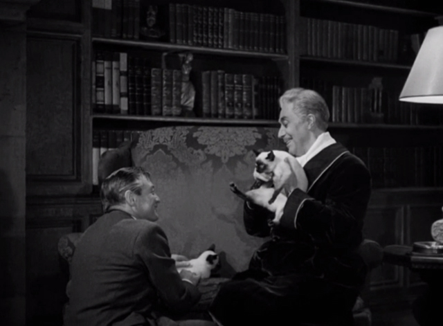 The Mask of Dimitrios - Cornelius Leydon Peter Lorre and Grudek Victor Francen with two Siamese cats Eloisa and Abelard on divan