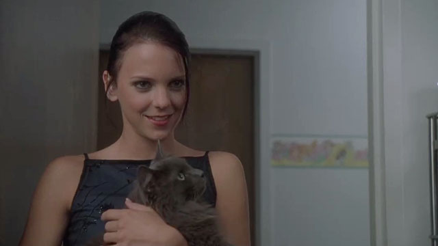 May - Polly Anna Farris holding longhair grey cat Lupe