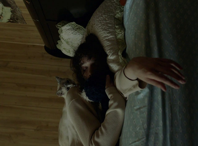 McCrorey Rd. - Gloria Cole lying on bed with lilac point Siamese cat