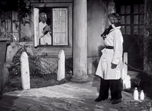 Medal for the General - McNab John Laurie holding black cat in window with milk lady