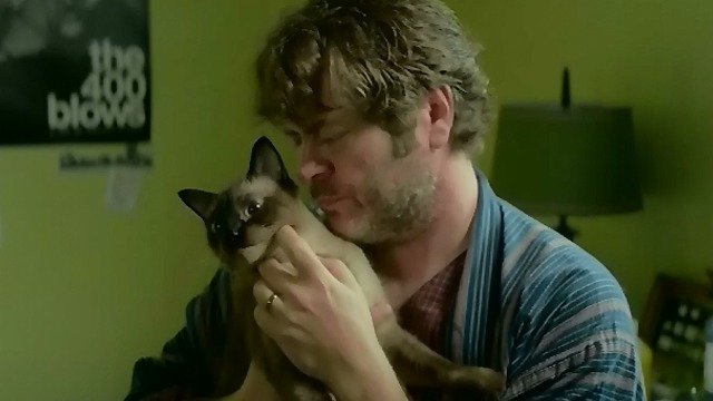 Me and Earl and the Dying Girl - father Nick Offerman holding Cat Stevens