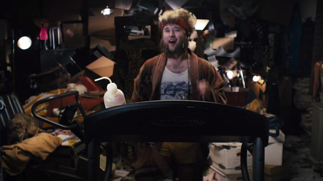Me Him Her - Haley Joel Osment on treadmill surrounded by cats