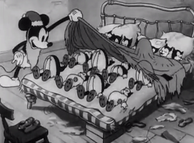 Mickey's Good Deed - Mickey Mouse looking at multiple kittens lying in bed