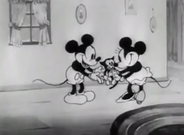 Mickey's Orphans - Mickey Mouse gives Minnie Mouse black kitten