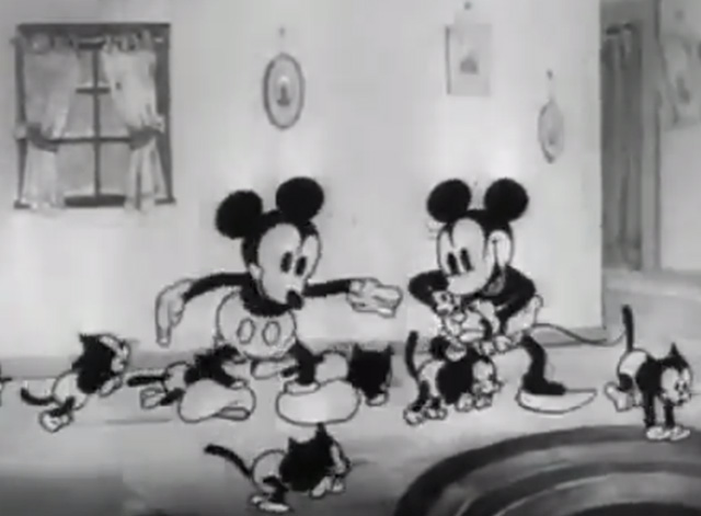 Mickey's Orphans - Mickey and Minnie Mouse with numerous black kittens running by them