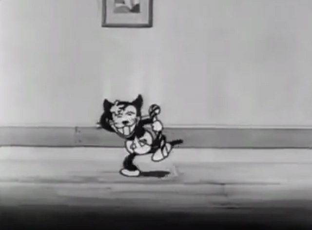 Mickey's Orphans - black kitten with candy cane acting like Charlie Chaplin