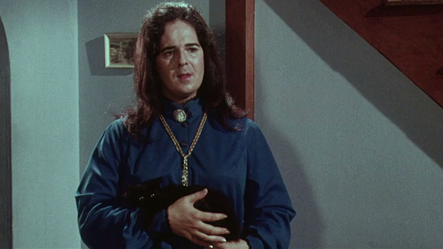 Miss Leslie's Dolls - Miss Leslie Salvador Ugarte holding black cat Tom