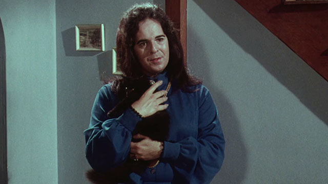 Miss Leslie's Dolls - Miss Leslie Salvador Ugarte holding black cat Tom