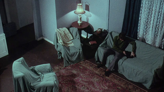 Miss Leslie's Dolls - Roy Chris Pitt sitting next to black cat Tom on covered couch