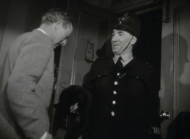 Miss Robin Hood - policeman Charles Farrell hanging tuxedo cat over to Henry Richard Hearne at door
