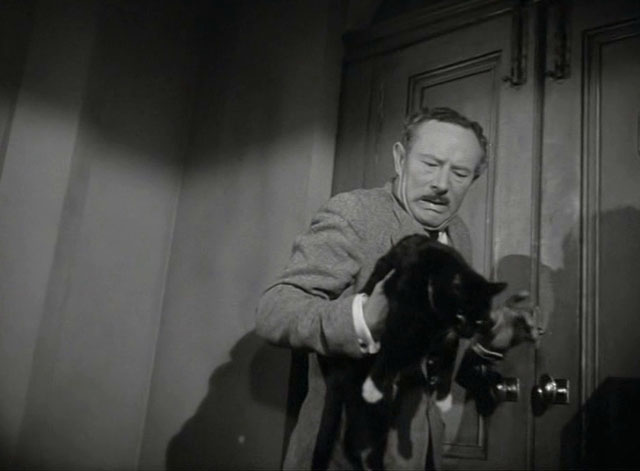 Miss Robin Hood - Henry Richard Hearne holding tuxedo cat at door