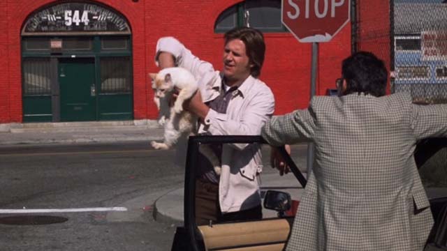 The Morning After - flame point cat fidgeting while being held by Turner Jeff Bridges with Sergeant Greenbaum Richard Foronjy
