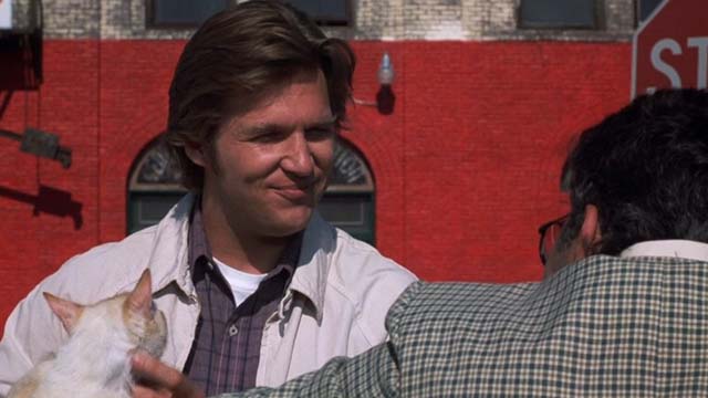 The Morning After - flame point cat being held by Turner Jeff Bridges as he talks to Sergeant Greenbaum Richard Foronjy
