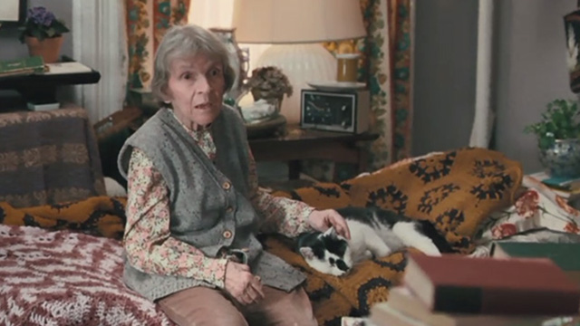 Motherhood - Edith Alice Drummond petting tuxedo cat Lady on bed