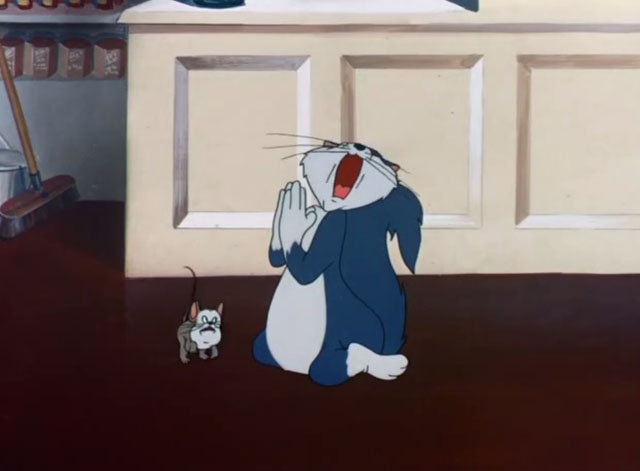 The Mouse-Merized Cat - cartoon blue cat praying with Catstello mouse barking at him