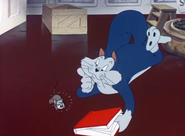 The Mouse-Merized Cat - cartoon blue cat with book looking at Catstello mouse