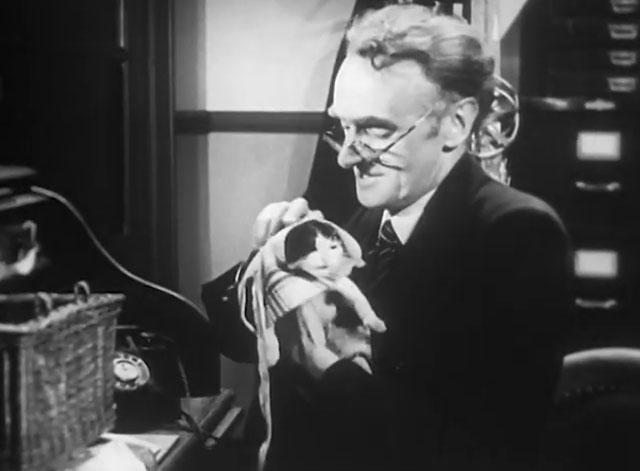 Mr. Beamish Goes South - Potter John Laurie dressing black and white tuxedo kitten in coat