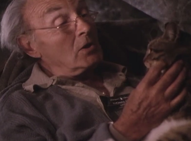 Mr. Love - Theo Maurice Denham holding tabby cat on lap