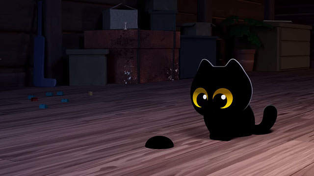 My Cat Lucy - cartoon wide eyed black kitten looking at hairball