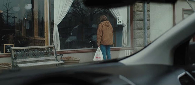 New Life - Jess Hayley Erin looking at tuxedo cat sitting in window of cafe