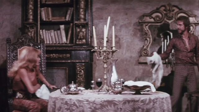 The Night of 1000 Cats - white cat being grabbed violently by Hugo Stiglitz